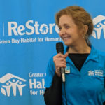 Maureen Meinhardt, director of the Greater Green Bay Habitat for Humanity ReStore, welcomes the crowd.